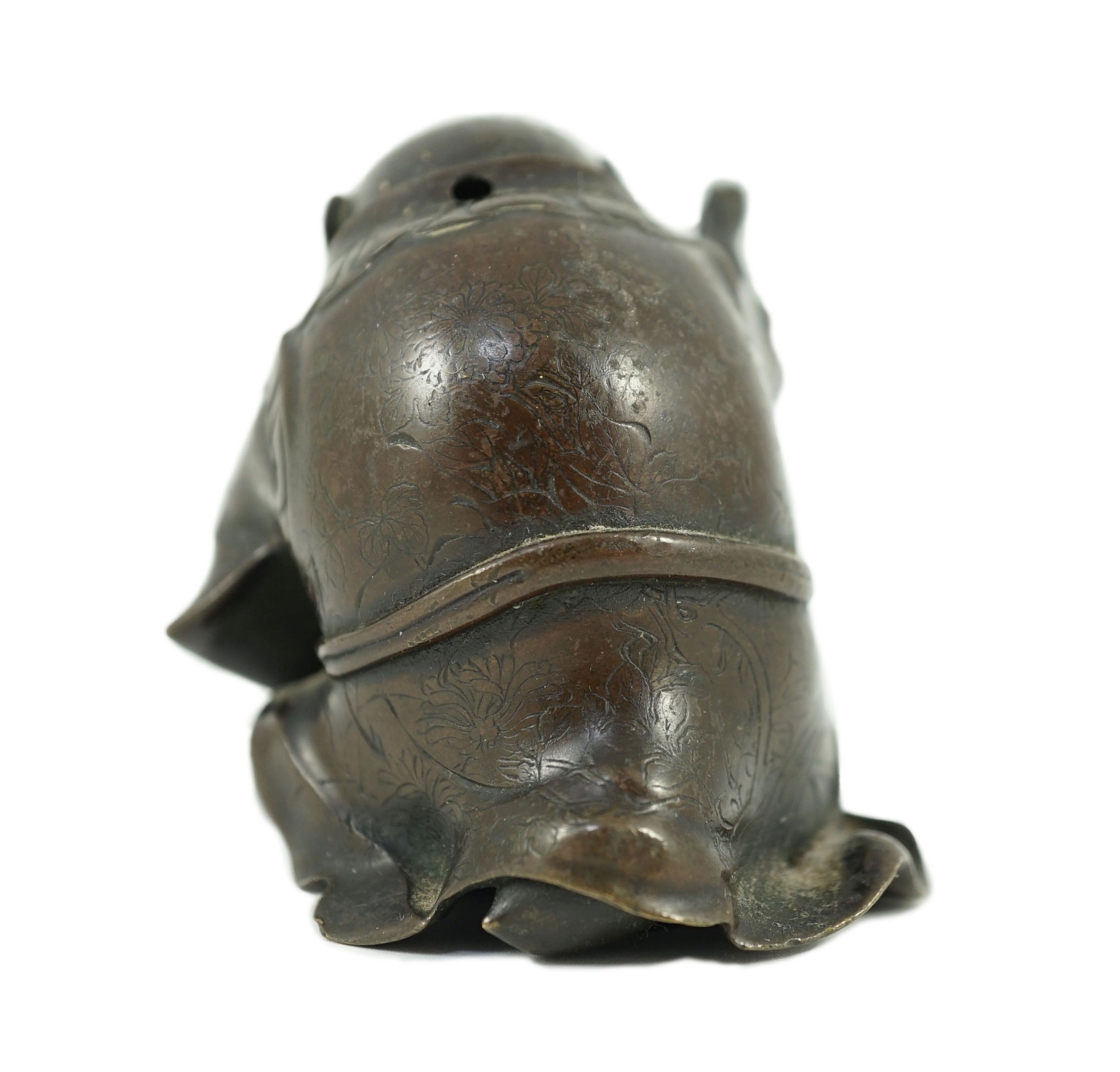 A Japanese bronze figure of a monkey, 19th century, 6cms high.
